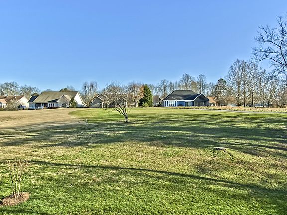 Image 2: 06_InataCircle_103_PorchGolfView