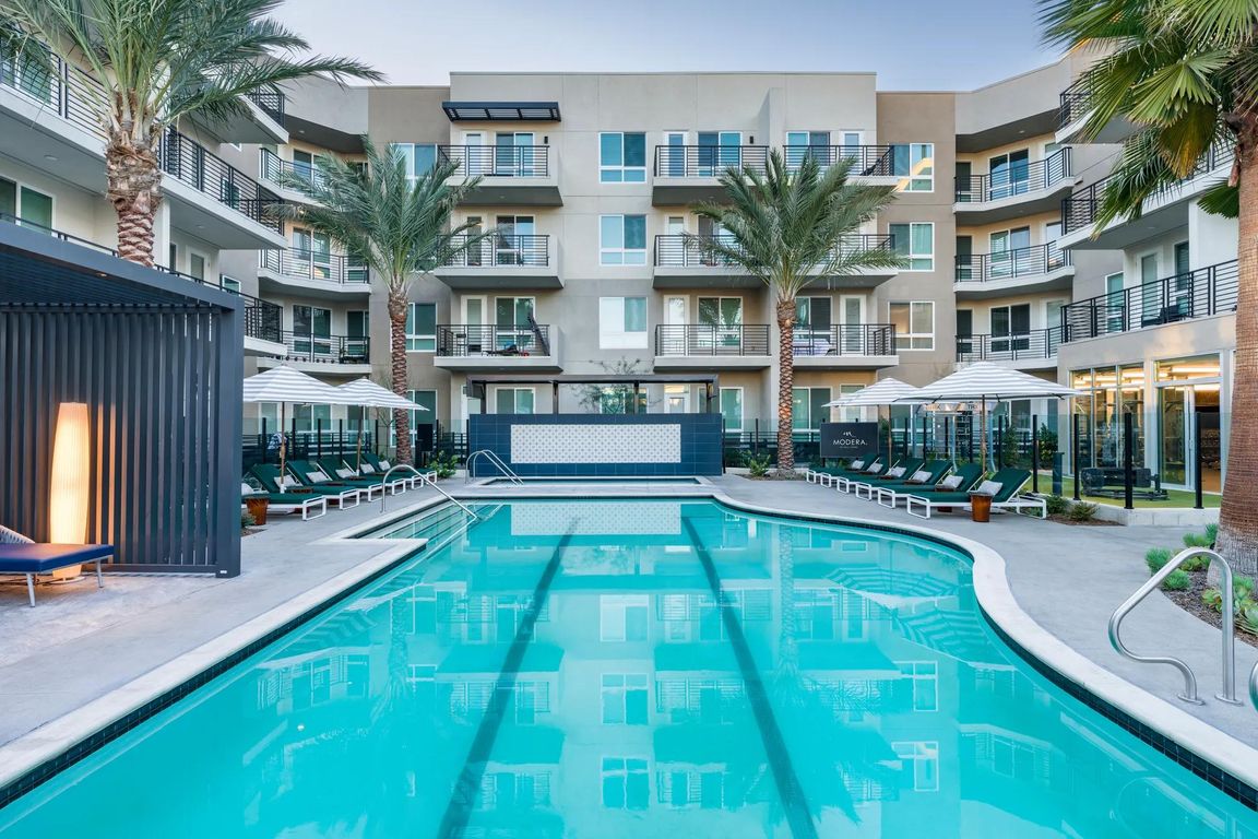 Enjoy a resort-style pool with a peaceful lounge area at Modera Pomona.