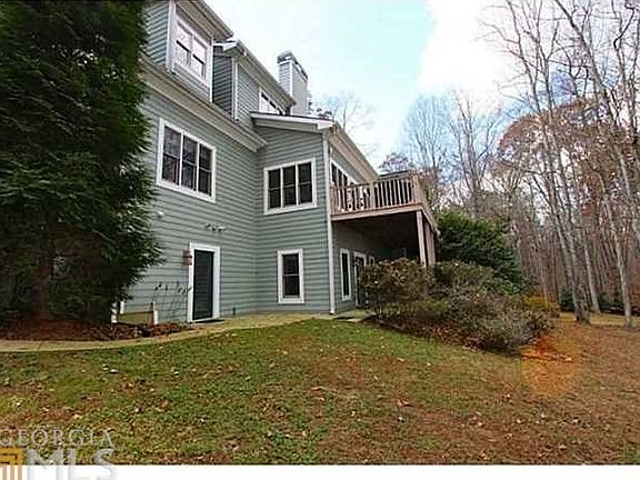 Lower level view with sidwalk and very large patio. Great for lakeside entertaining.