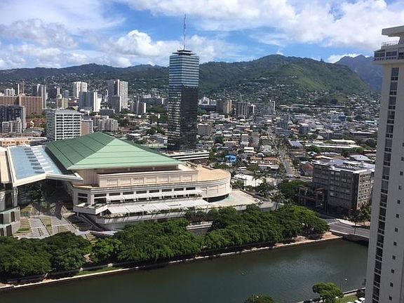 View of beautiful mountains, Hawaii Convention Center and Ala Wai canal from private deck