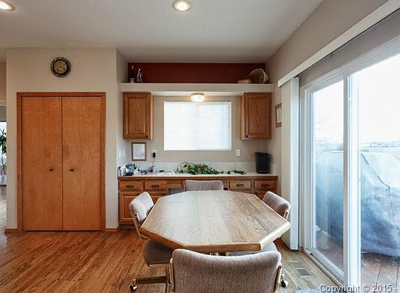 Large eating space in kitchen. Note planning desk and storage i