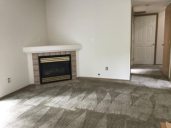 Family room with gas fireplace at ground level.