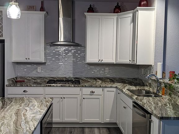 Kitchen with dishwasher and microwafe opposite each other