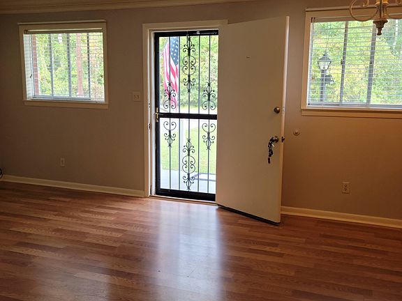 Living Room/Front door. Crown molding and FRESH paint throughout the apartment. New energy saving windows and New blinds, laminate flooring.