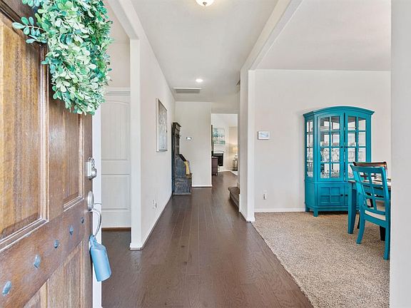 When you enter this home you notice the beautiful wood floors and dining room to your right.