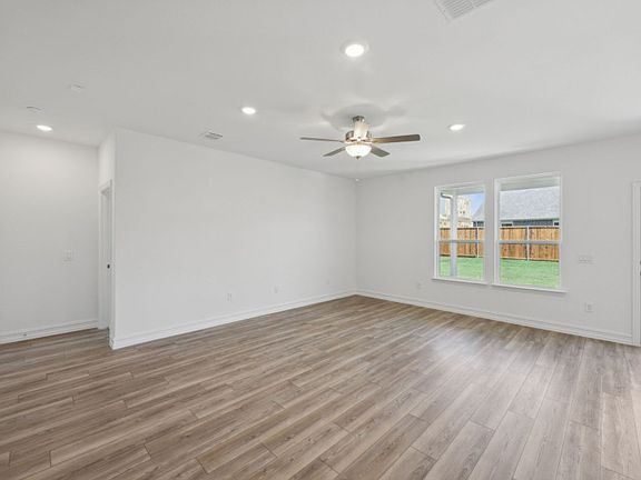 Sunbathed gathering room with expansive windows