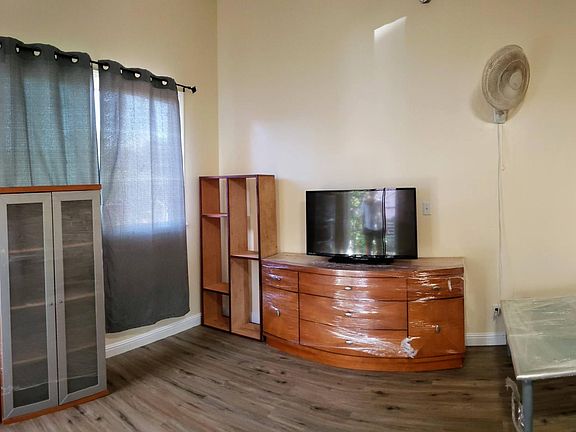 Living room: big front window and cathedral ceilings.