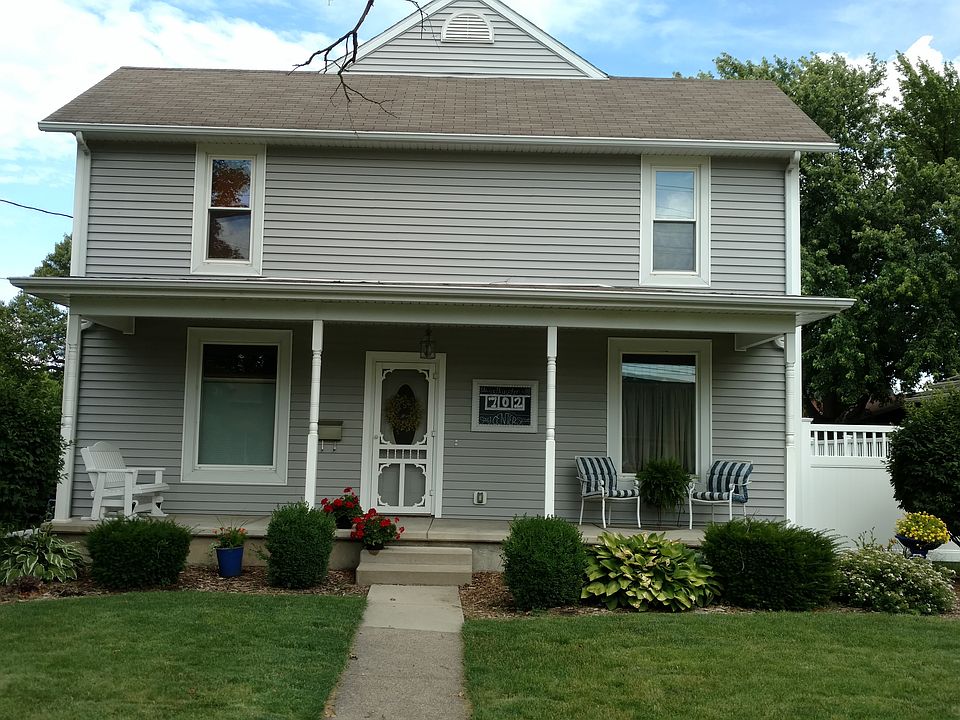 Front porch with glider. 