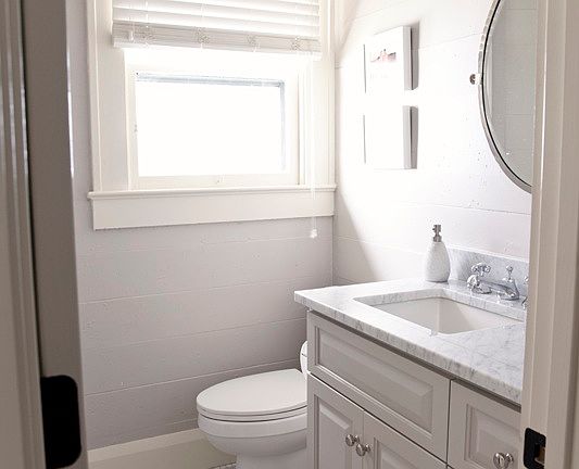 newly remodeled bath with marble vanity and stand up shower