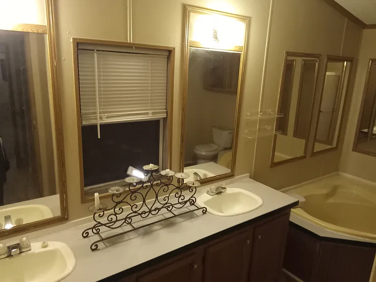 Primary restroom separate tub and shower.