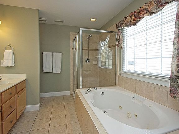 MASTER BATH- TILE FLOOR, SHOWER, JETTED TUB,DUAL VANITIES!