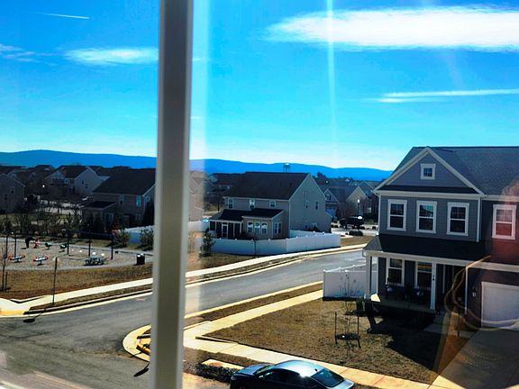 Enjoy the beautiful mountain view of Sunset/sunrise of West Virginia skyline from the 2 floor bedroom, with Kids play area and Single family homes in front.