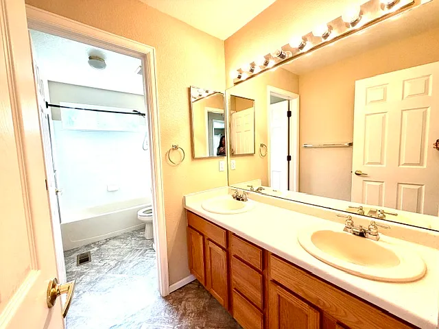 Guest bathroom with double sinks.