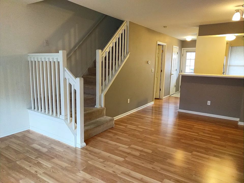 First floor partial view showing entry, breakfast bar and stairwell to second floor.