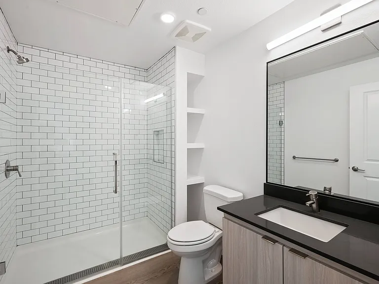 Designed for everyday comfort, this elegant bathroom showcases a spacious walk-in shower