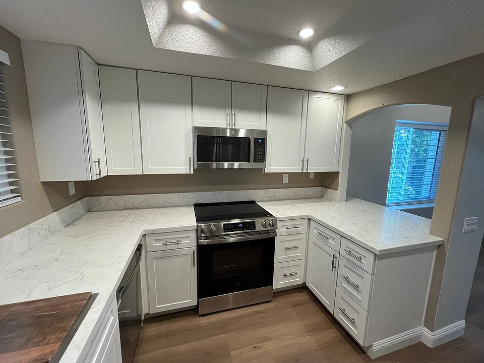 Plenty of custom floor to ceiling cabinets with lots of storage including a lazy Susan.