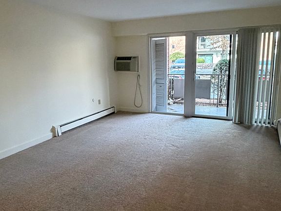 Large Living/family room with all new carpet open to private patio