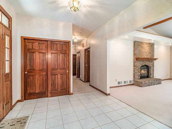 Large Foyer with ceramic tile and guest coat closet welcomes you into this open floor plan home.