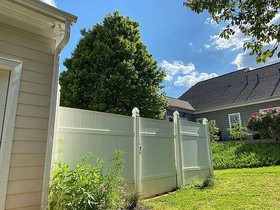 WHITE FENCED BACKYARD