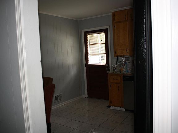 Living room opens to kitchen area.