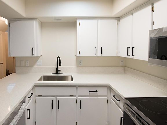 All kitchen appliances, sink, faucets and top quality quartz countertop are brand new.