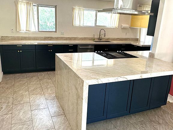 All new top-of-the-line kitchen with thick quartzite slab counters, new cabinets with soft-pull hardware.