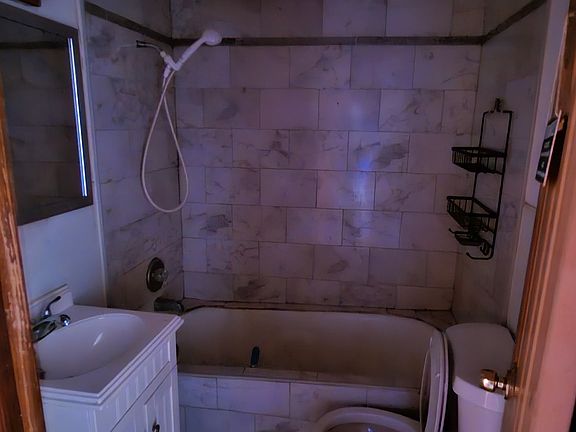 Batlhroom ;in hall , lickers on the opersit side.