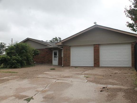North facing side of home. 2nd driveway. Door leads to enclosed patio.