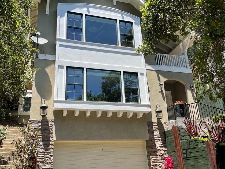 Living space is the apartment with windows downstairs, owner lives above.