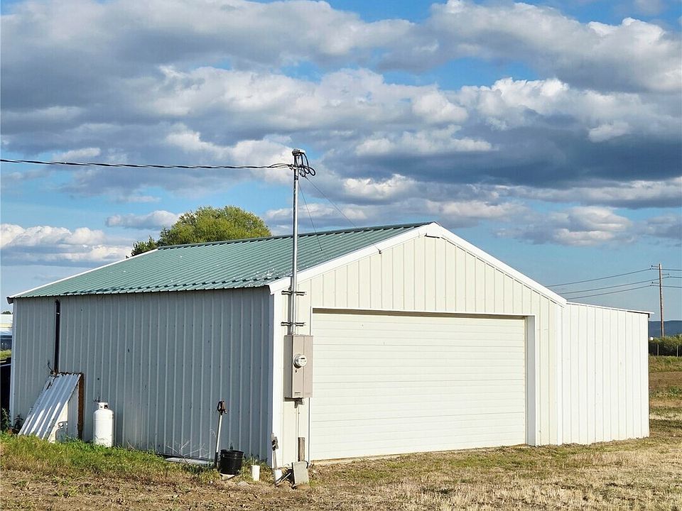 Shop with covered parking on the opposite side>