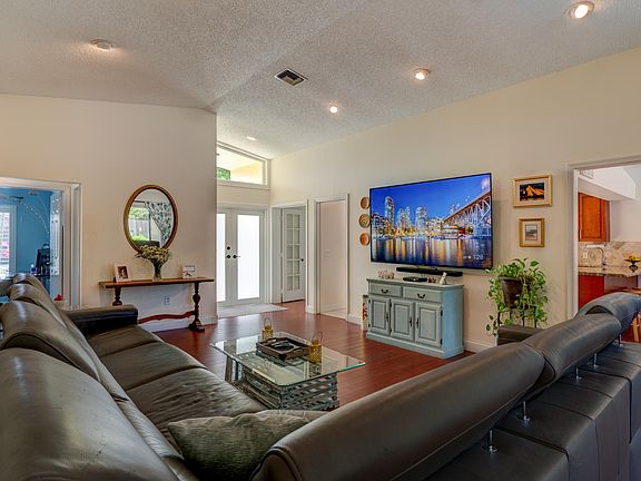 Enter double doors to living room 4th bedroom off to left used as office