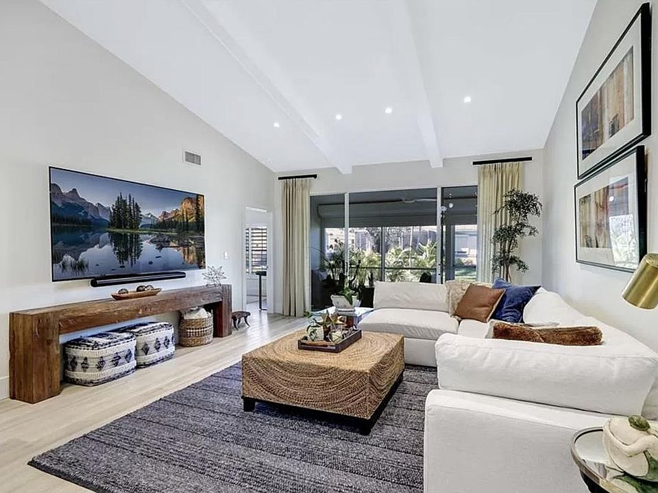 Main living space - open from kitchen - high vaulted ceilings with beams. Additional led lighting added as well as a feature light