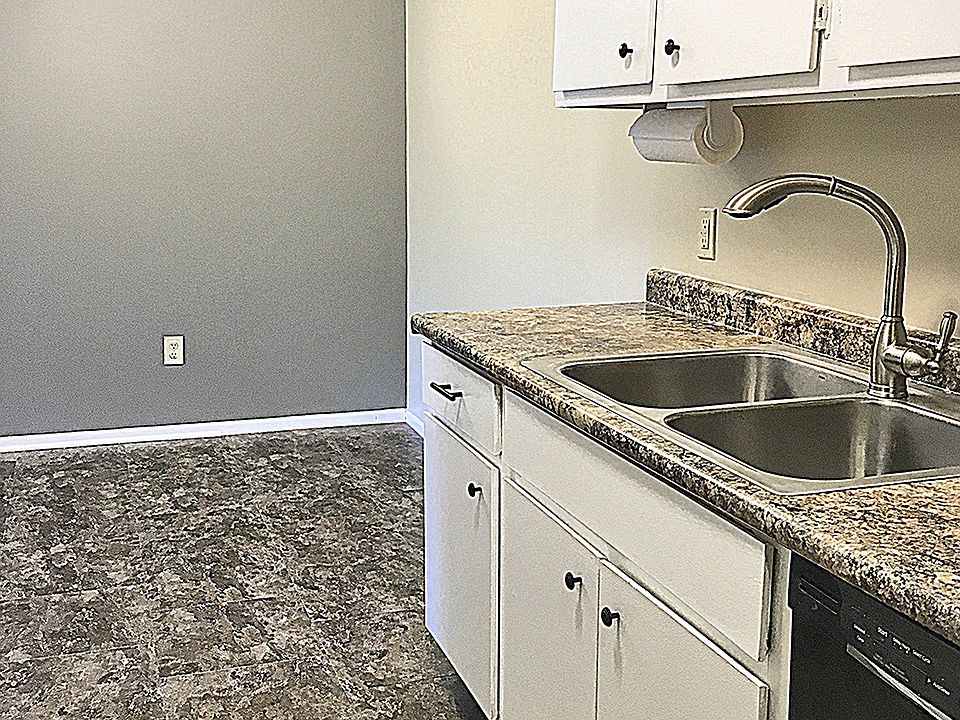 Kitchen has newer flooring, countertops, paint and appliances
