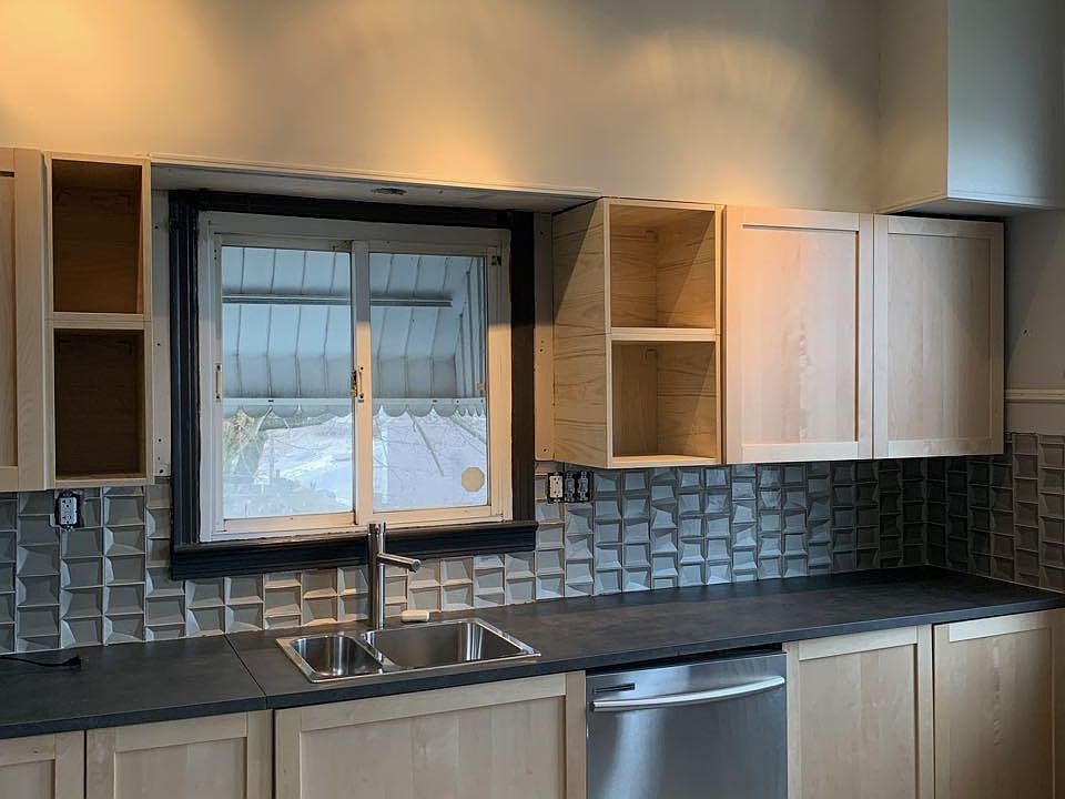 All new kitchen cabinets. 3D glass tile backsplash. Dishwasher and garbage disposal