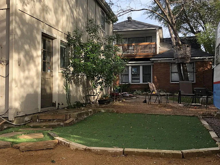 The backhouse is a separate structure with private entry (shown here) from your parking space and from the street.