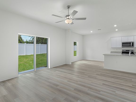 The family room has a sliding door that leads to the back patio