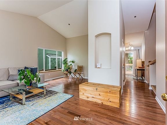 Circular floor plan with lush hardwoods underfoot, vaulted ceilings overhead. Enjoy oodles of light.