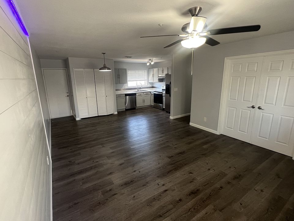 Main living space looking in towards kitchen and laundry.