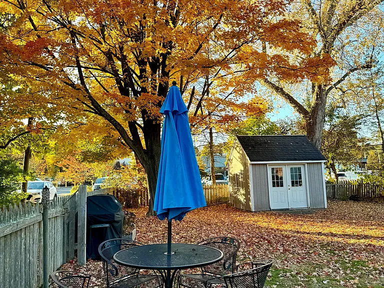 LARGE FENCED IN BACKYARD, STEPS FROM COMMUTER RAIL