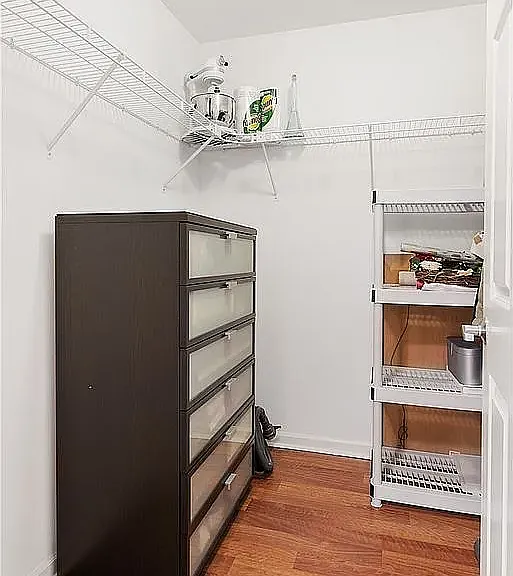 Separated pantry next to kitchen & entry