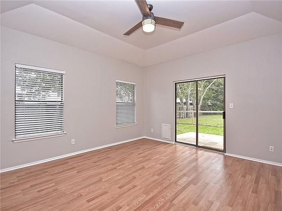 Vaulted ceiling in the master with private deck access to gorgeous backyard