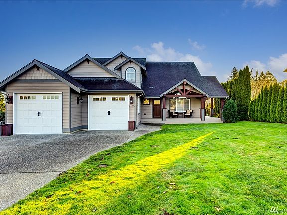 Extra deep garage bay and large, private front yard.
