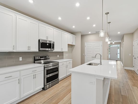 Harbor II Kitchen with White Cabinets and Large Island