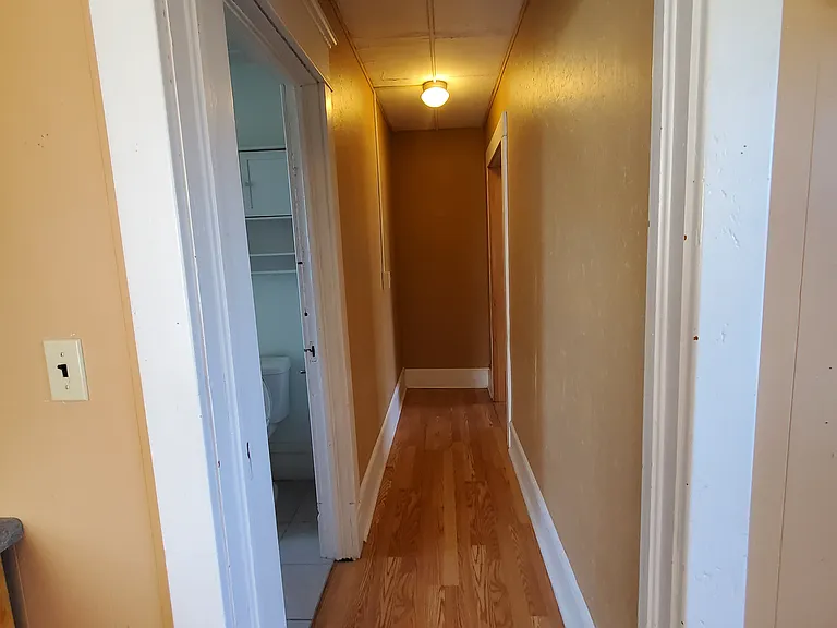 Hall to bedroom from kitchen