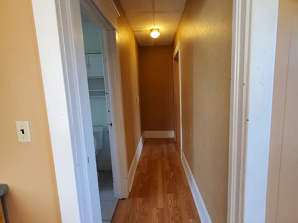 Hall to bedroom from kitchen
