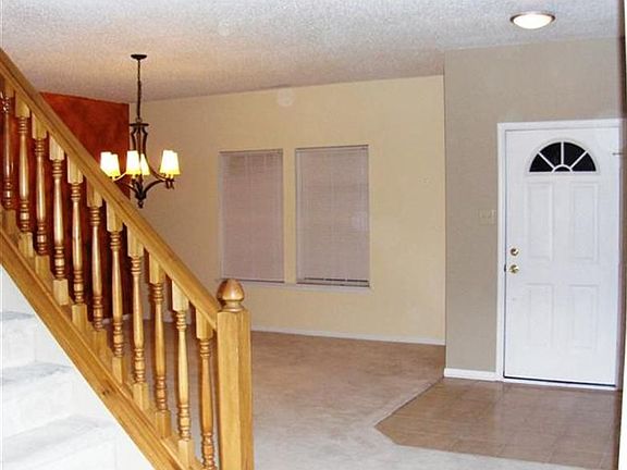 Large Formal DR off foyer features beautiful upgraded light fixtures. 