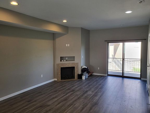 Large Living Room with Fireplace and Balcony