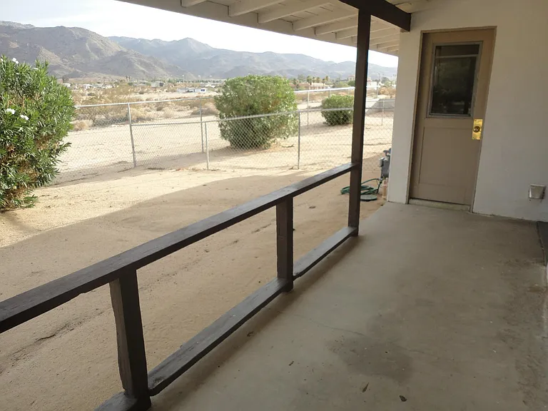 COVERED BACK PORCH TO STORAGE ROOM