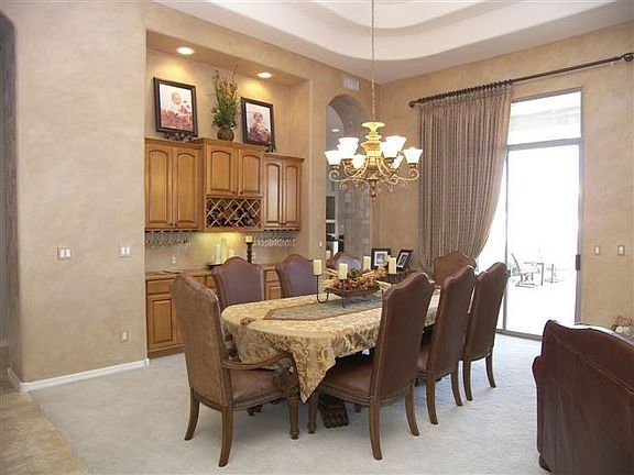 Elegant Formal Dining Rm w/Built in Maple Cabinets w/Custom Litng 