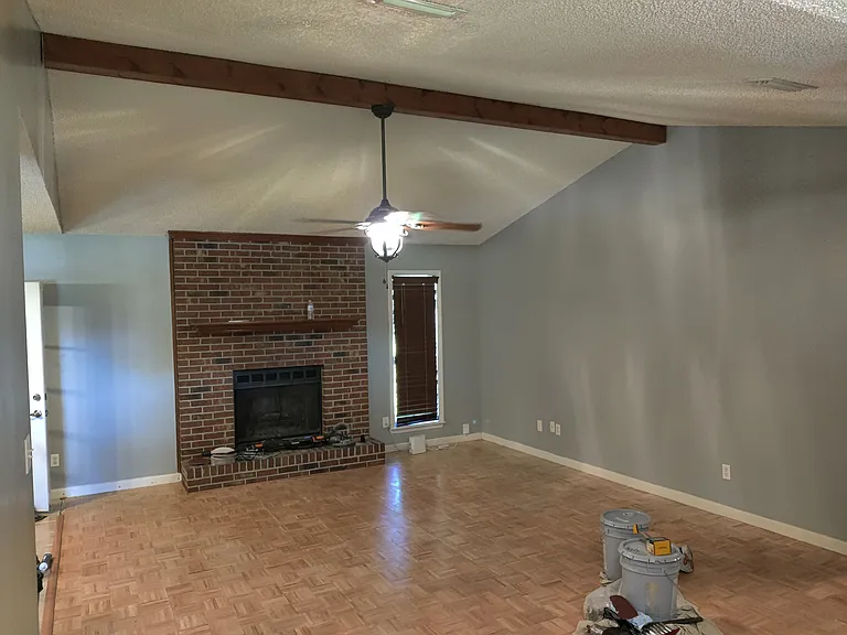 living room view from front door, cieling fan, parque wood floors, fireplace and cieling fan